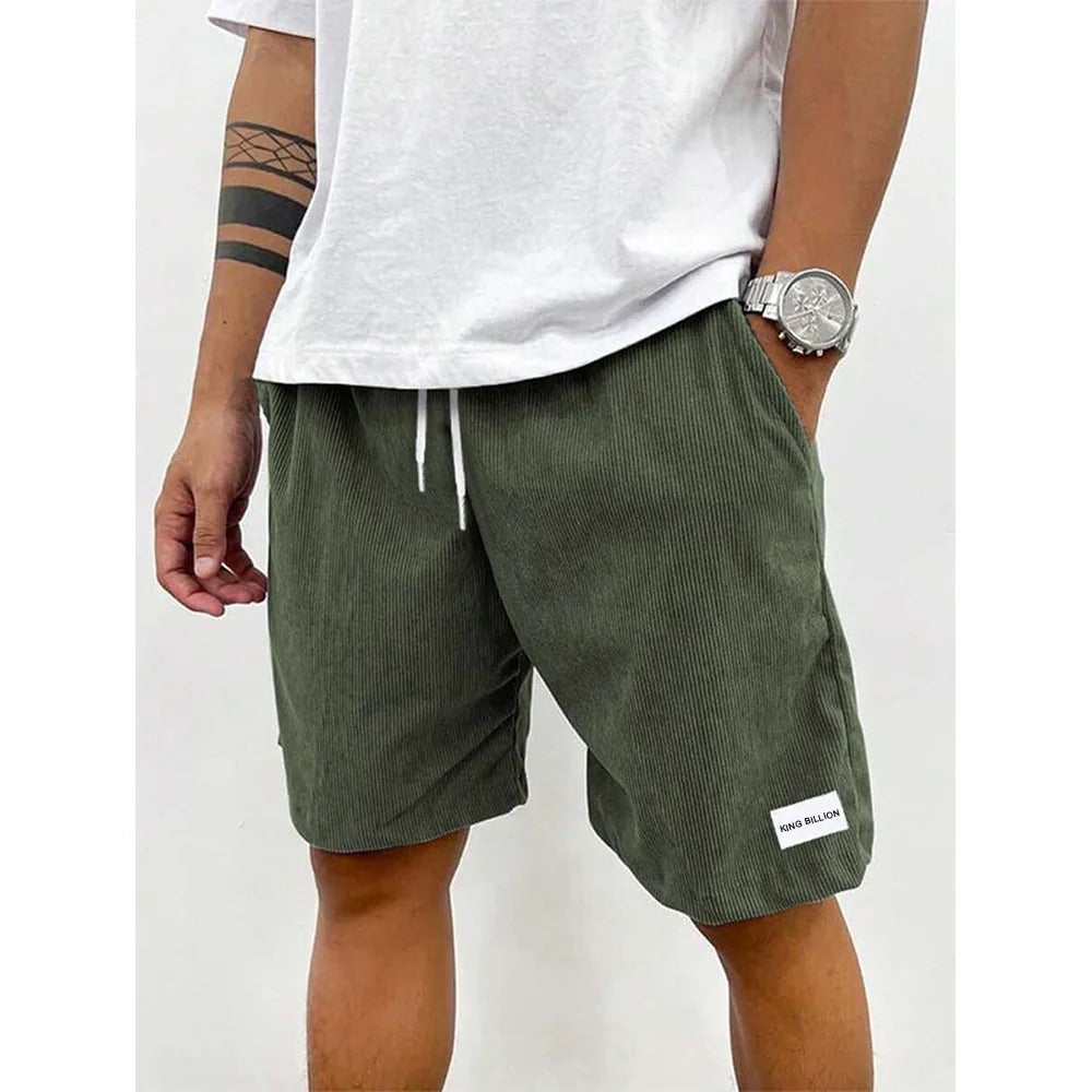 "Blå corduroy-shorts for menn med myk struktur, avslappet passform, ideell for casual stil og uformelle utflukter."