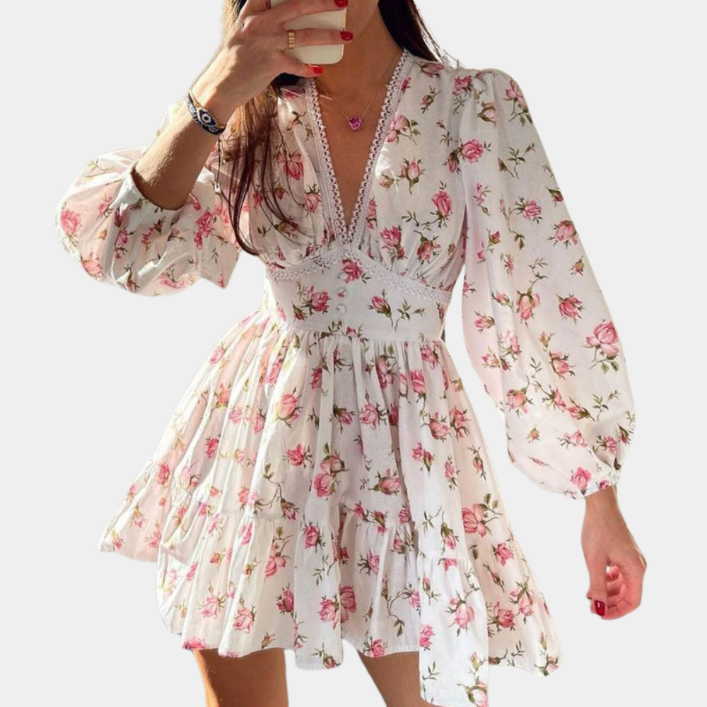 "Blomstret hvit dame sommerkjole med V-hals, elegant design, lett materiale, perfekt for varme dager."