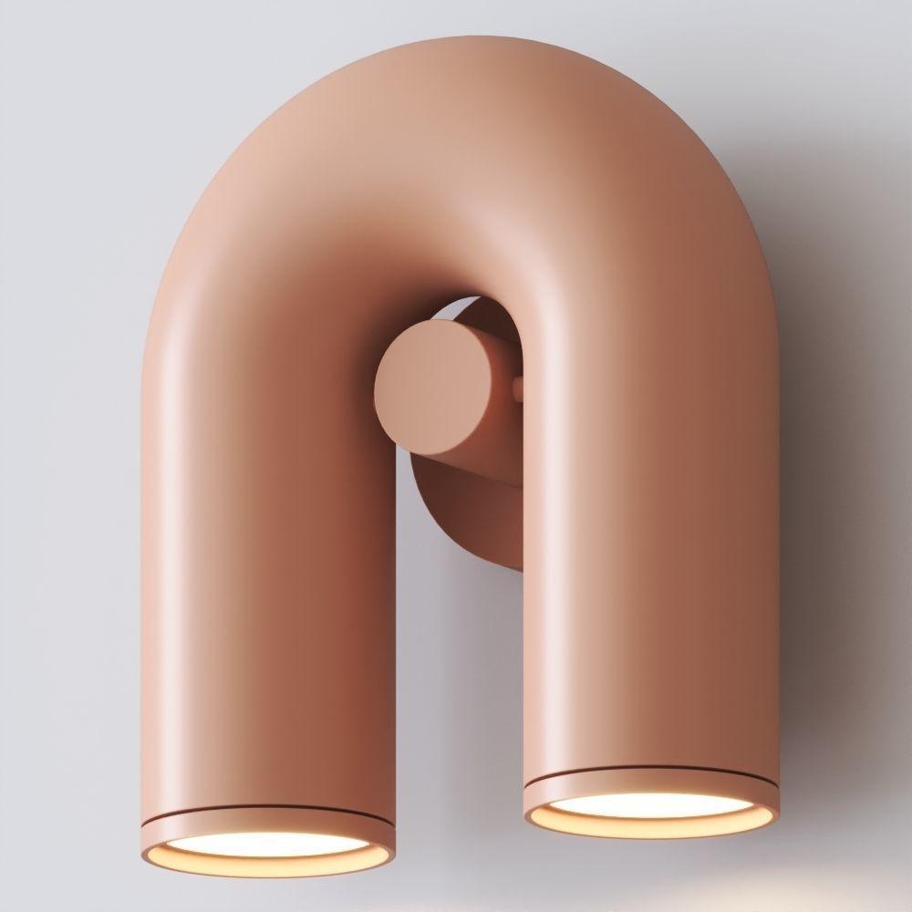 "Cirkus justerbar LED vegglampe med U-formet modul, elegant design for moderne innendørs belysning."