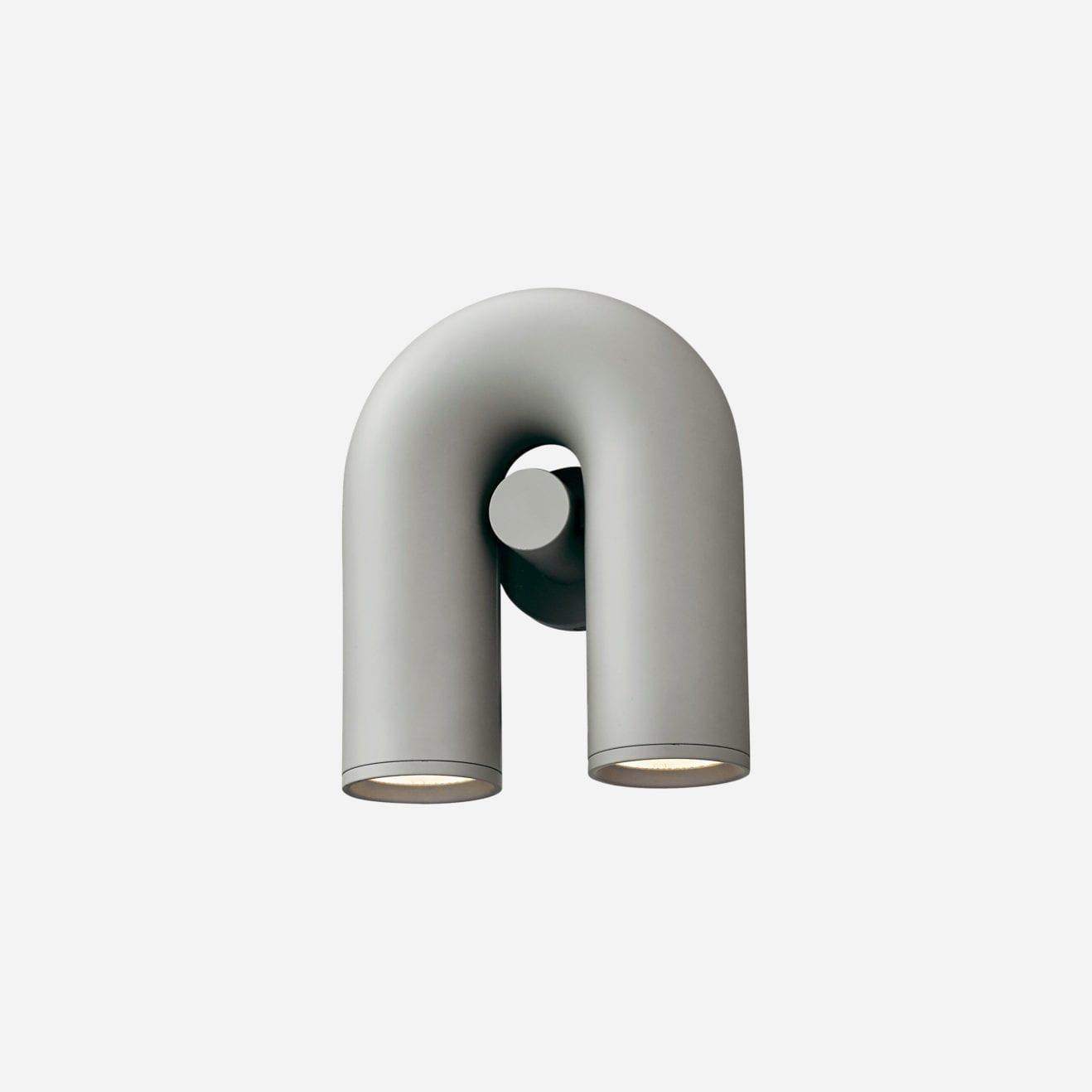 "Cirkus justerbar LED vegglampe med U-formet modul, elegant design for moderne innendørs belysning."