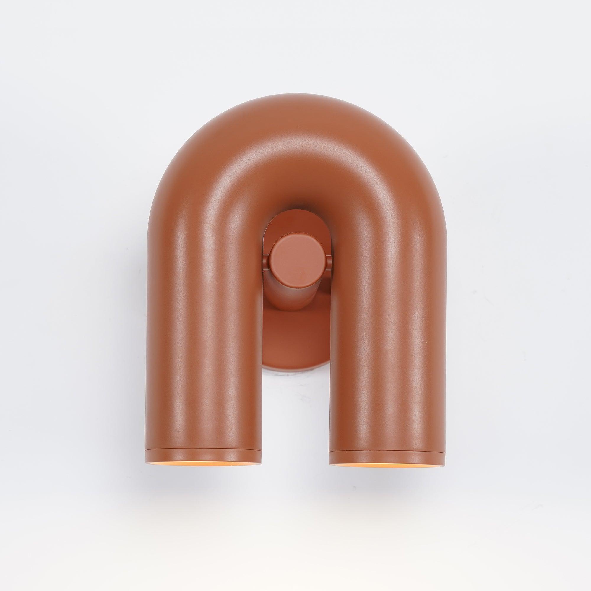 "Cirkus justerbar LED vegglampe med U-formet modul, elegant design for moderne innendørs belysning."