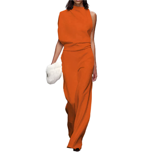 Dame jumpsuit i løs, ermeløs passform. Komfortabel sommeroverall for fritid, elegant og ensfarget.