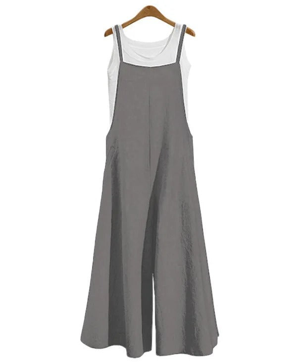 Komfortabel ermeløs damejumpsuit med vide ben. Løs passform for sommer, hverdag og ferie.
