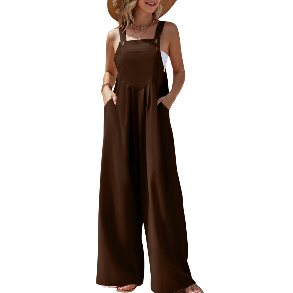 Avslappet ensfarget damejumpsuit, brede bukseseler, løs passform; perfekt for sommer og ferie.