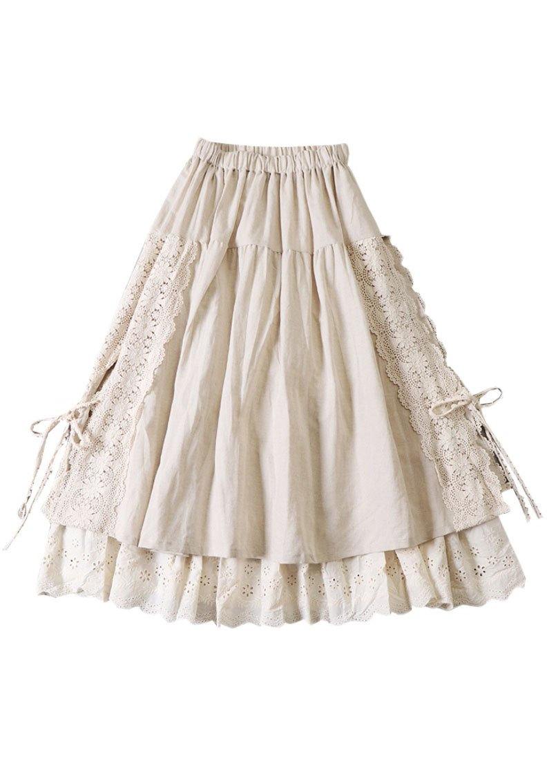 Dameskjørt for høsten, med rynker og patchwork-design i beige og brune toner. Komfortabelt og elegant.