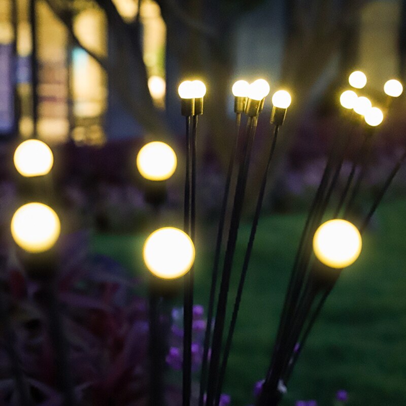 LED-solcellelys med dynamisk ildflueeffekt. Ideelt for å lyse opp stier, blomsterbed og uteområder.
