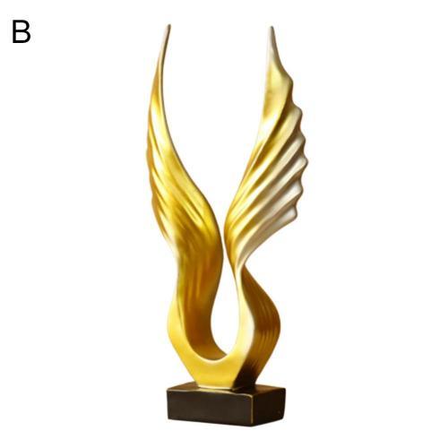 Englevinge skulptur i fokus, med mykt lys som fremhever dens eleganse som pynt.