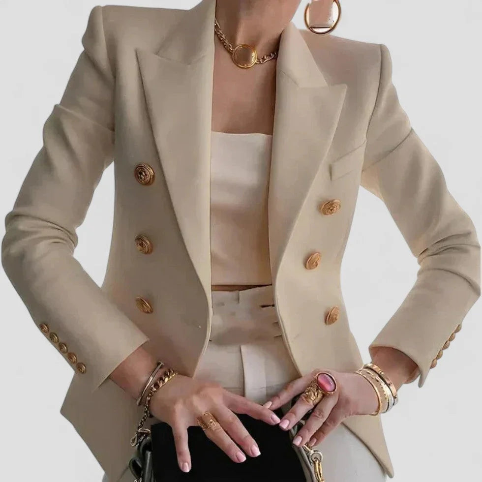 Sofistikert dobbeltspent blazer for kvinner, prydet med glitrende gullknapper. For en tidløs og elegant look.