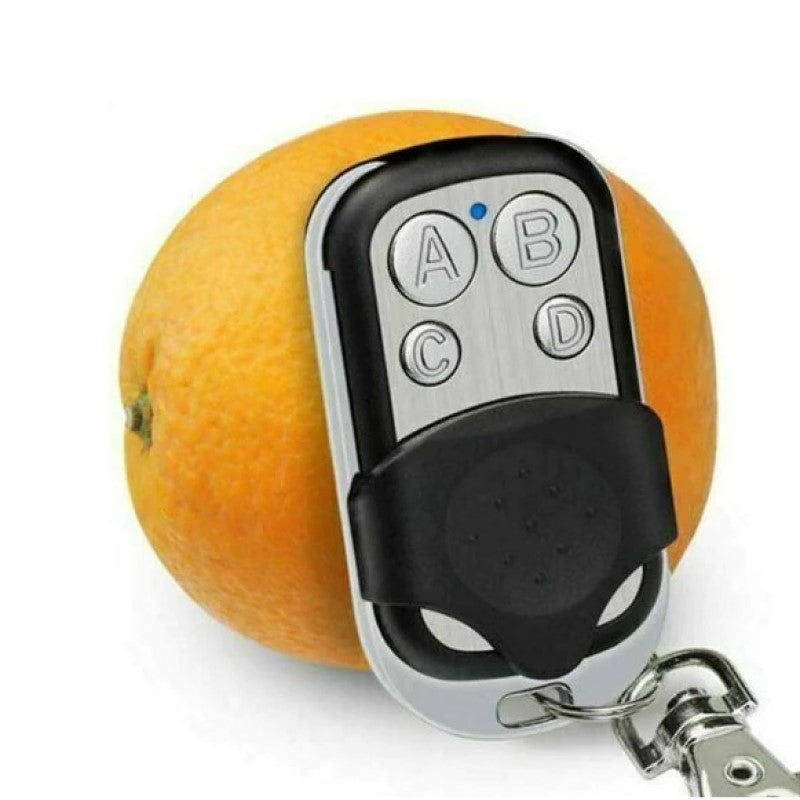 "Effektiv fjernkontroll duplikator med 4 funksjonsknapper og kompakt design for enkel nøkkelsignal kopiering."