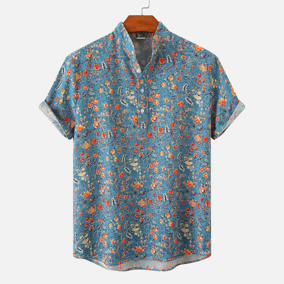 "Elegant blå unisex skjorte med moderne design og tropisk stil, perfekt for alle sesonger og enhver anledning."