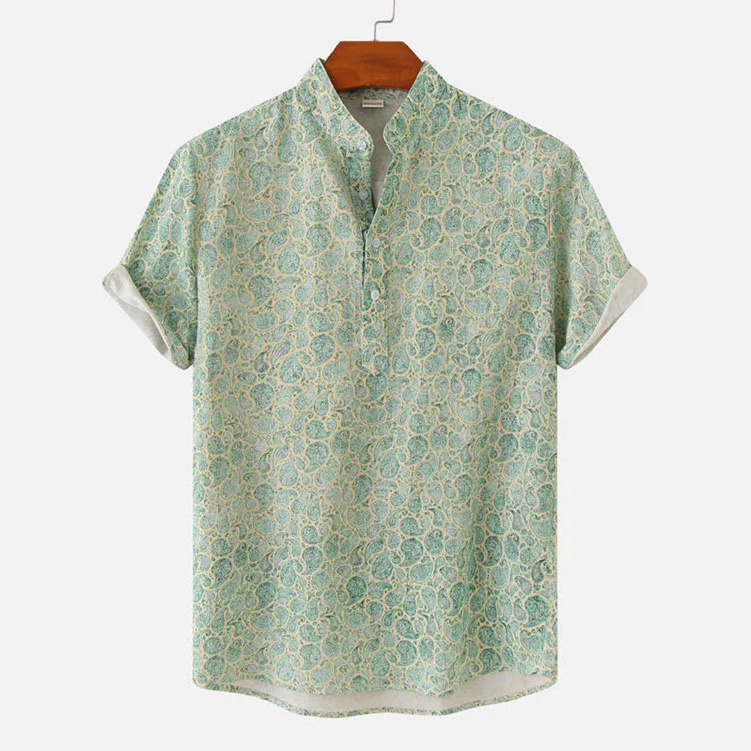 "Elegant blå unisex skjorte med moderne design og tropisk stil, perfekt for alle sesonger og enhver anledning."