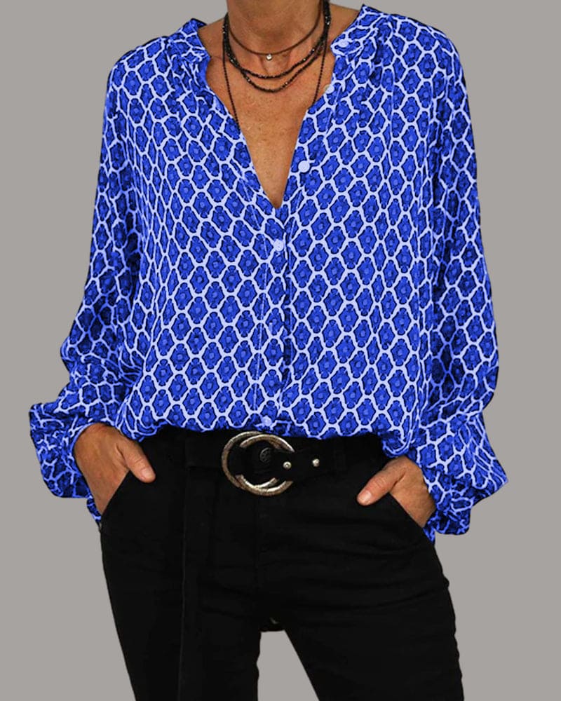 "Elegant blomstrete bluse for kvinner, lange ermer, fargerike blomster, perfekt for enhver årstid og anledning."