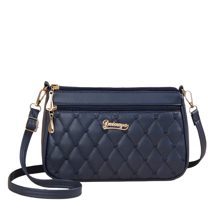 Brodert dameveske i PU-skinn, crossbody-stil, fremhever et moteriktig og elegant design.