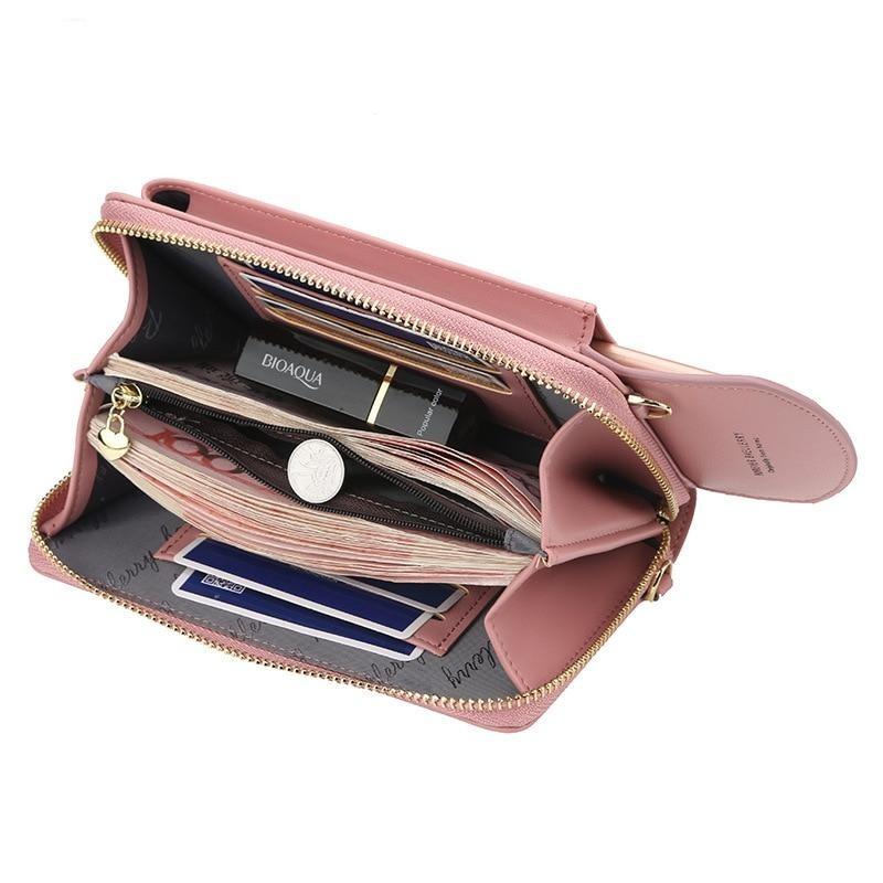 Chic svart skinnveske for kvinner, crossbody modell, med gullfarget lås, et must-have tilbehør.
