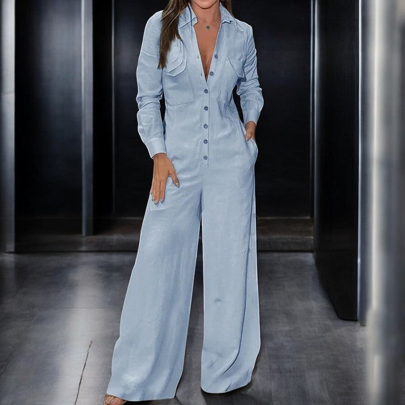 Komfortabel blå dame jumpsuit med vide ben, langermet design og stilig krage.