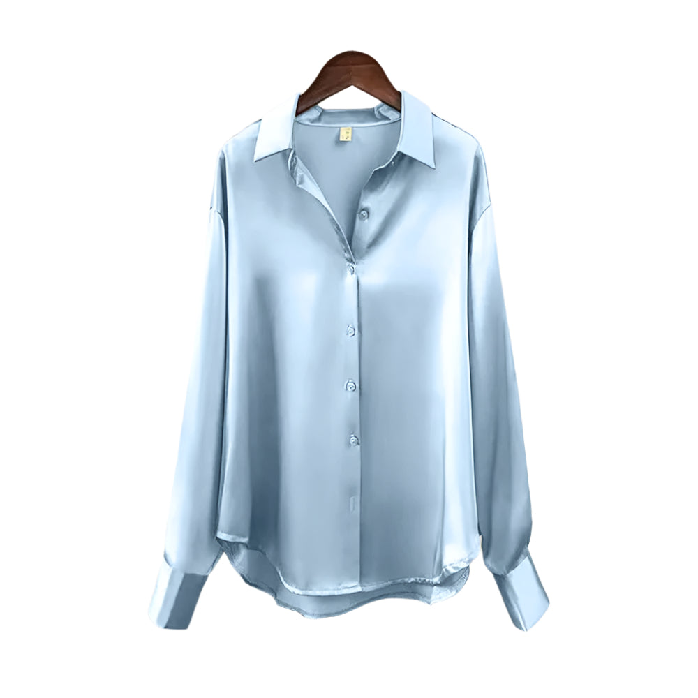 Damebluse med pen reverskrage og løs passform, elegant og behagelig for lang bruk.