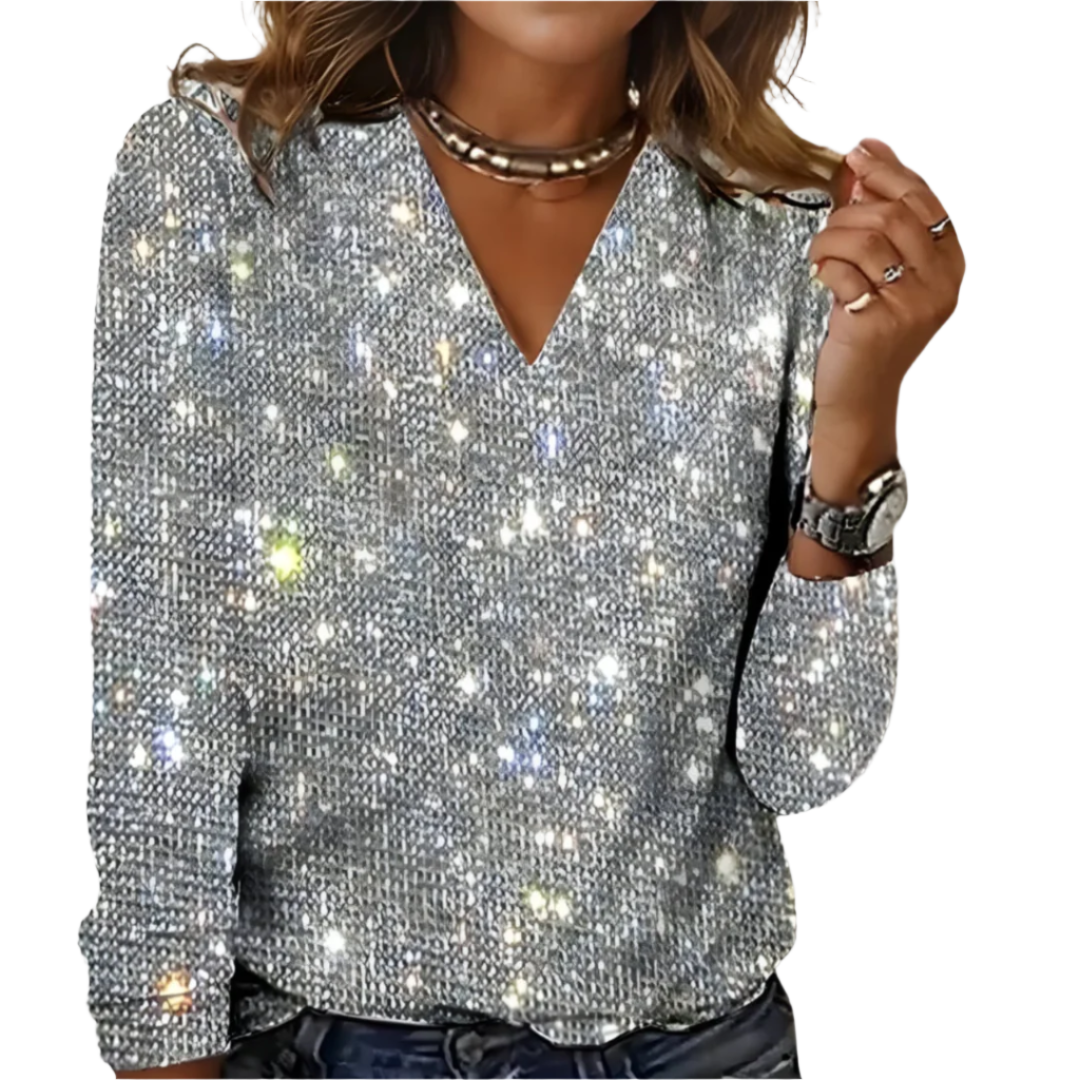 Elegant damebluse med V-hals og subtil diamanteffekt, perfekt som glitrende festtopp for selskap.