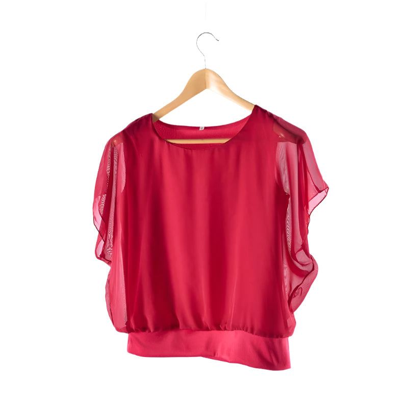Tidløs elegant volangbluse for kvinner med flaggermusermer, ideell for hverdagsbruk.