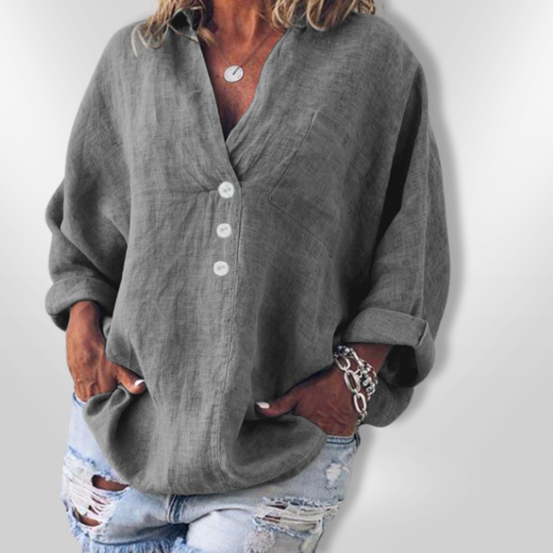 Damegenser med løs passform og langermet design. Elegant knappedetalj som gir en stilren hverdagslook.