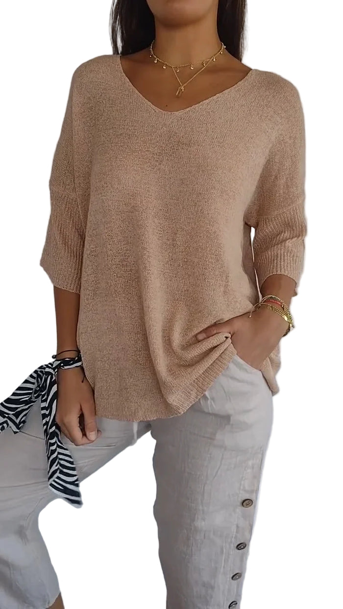 Elegant dametopp med V-hals for moderne kvinneklær. Perfekt for både hverdag og fest.