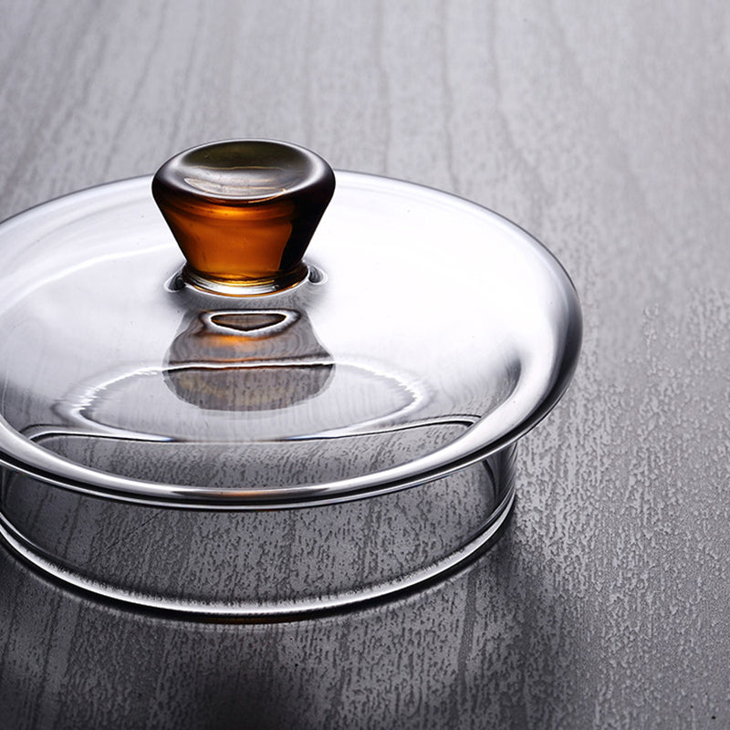 Slank design glass tekanne med infuser, perfekt for hjemme- og kontorbruk.
