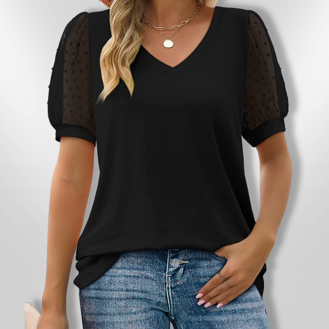 Stilig kvinnebluse med V-hals og trendy puffermansjetter, en feminin og allsidig vårtopp.