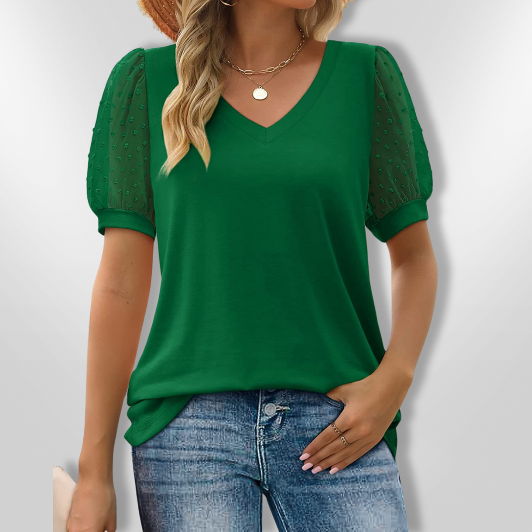 Komfortabel og elegant bluse med V-hals og puffermansjetter, passer til jobb, hverdag og fest.