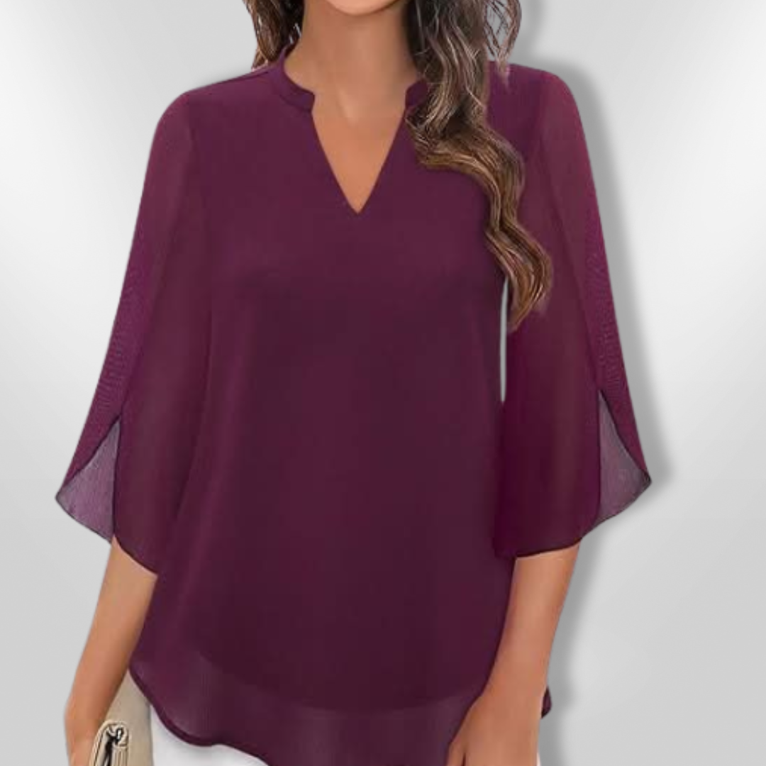 Kvinnebluse med stilig V-hals og lagdelt design. Allsidig topp for vår og sommer.