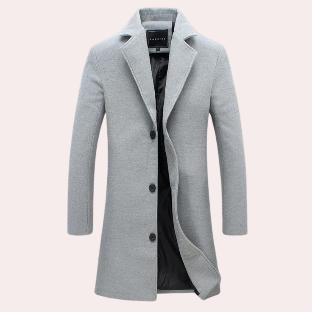 Moderne lang herrefrakk som kombinerer klassisk eleganse med stilrent design. Sofistikert yttertøy for menn.