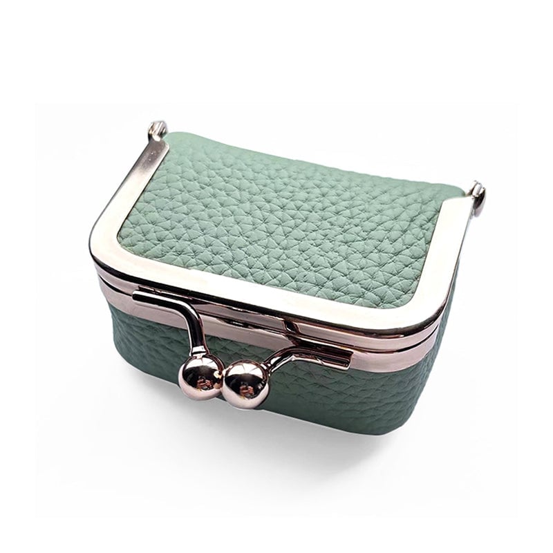 "Elegant mini smykkeskrin i ekte skinn med retro design, reisevennlig, tilgjengelig i flere stilige farger."