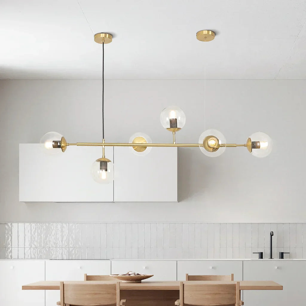 "Elegant pendellampe med glasskuler i gull eller svart, tilgjengelig i opal, gjennomsiktig, røykfarget, ravfarget."