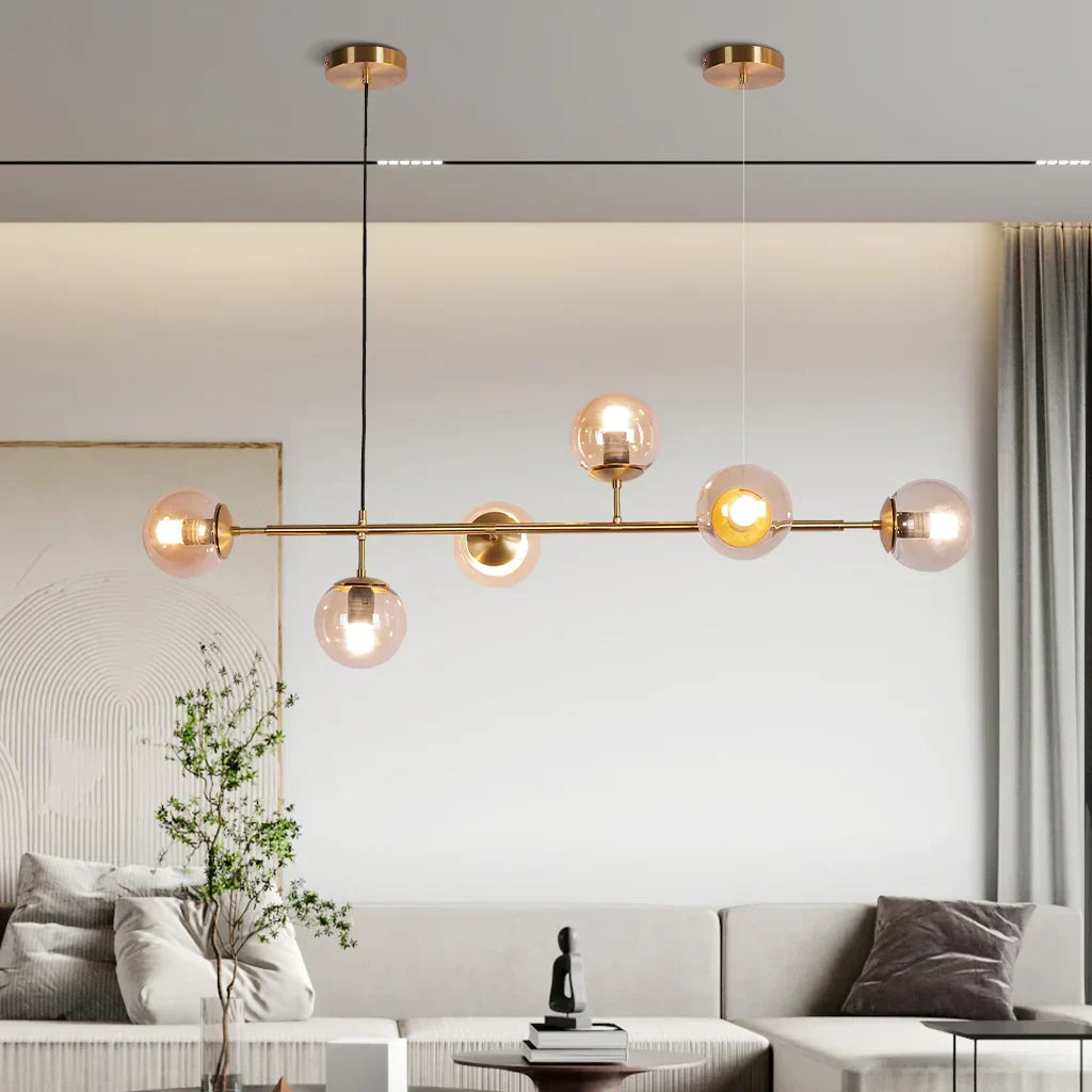 "Elegant pendellampe med glasskuler i gull eller svart, tilgjengelig i opal, gjennomsiktig, røykfarget, ravfarget."