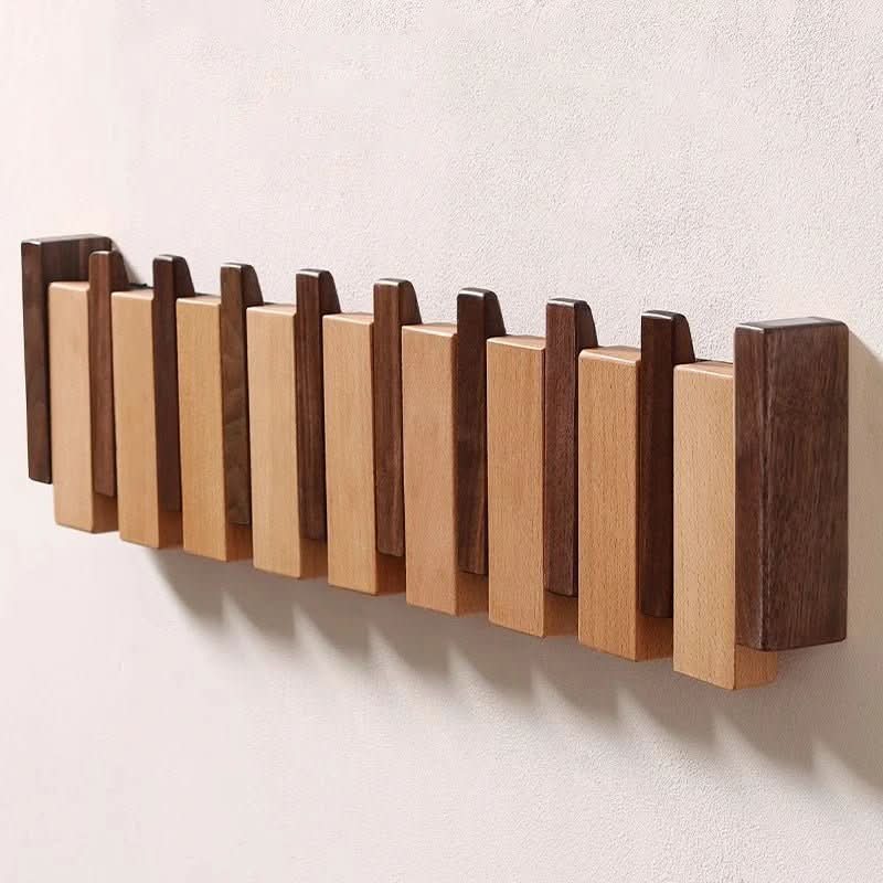 Valnøtt vegghenger i elegant pianostil. Optimaliserer oppbevaring og organisering i gangen og hjemmet.