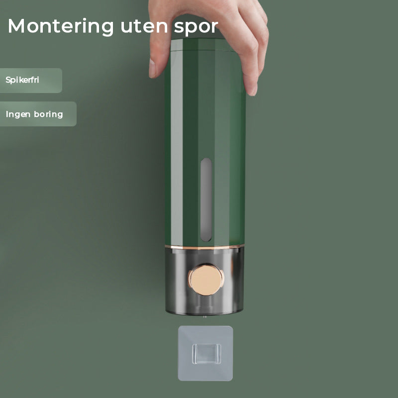 "Elegant veggmontert manuell såpedispenser i hvit, transparent kropp, praktisk for moderne baderom, lett å fylle."