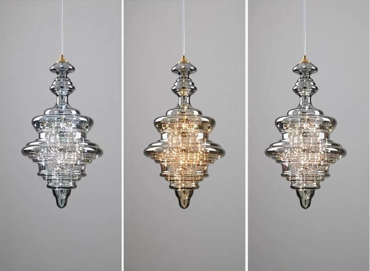"Elegante moderne pendellampe i grått glass med stjernehimmel-effekt, justerbar høyde, perfekt for alle rom."