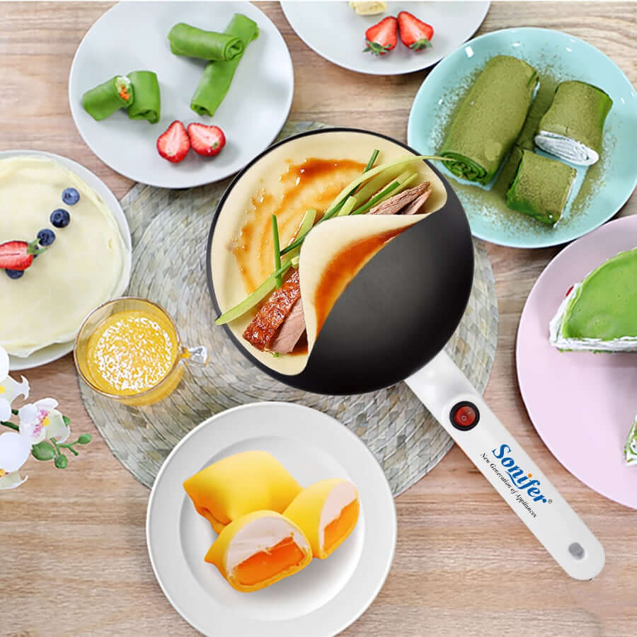Nærbilde av non-stick platen på crêpe makeren, som viser jevn varmefordeling for perfekte pannekaker.