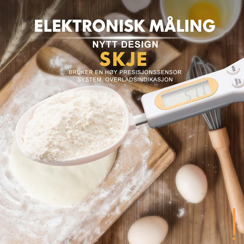 "Elektronisk måleskje med digital skjerm, hvit og svart design, perfekt for presise porsjonsmålinger i kjøkkenet."