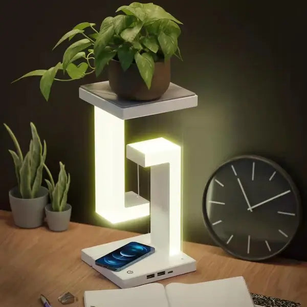 Moderne Tensegrity LED bordlampe med trådløs lading. Futuristik designlampe for et smart og stilfullt hjem.
