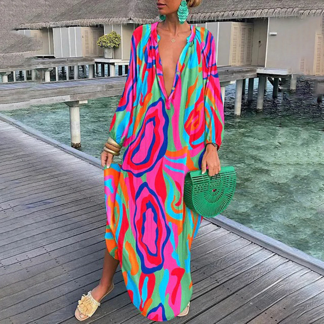 Grønn boho-kjole med bohemsk stil, lange ermer og luftig passform. Perfekt for sommer, strandturer og festivaler.