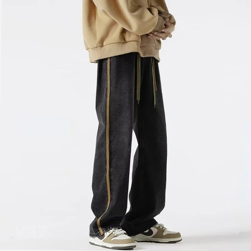 Stilige herrejeans med oversized passform og elastisk midje. Trendy bukser som kombinerer komfort og moderne look.