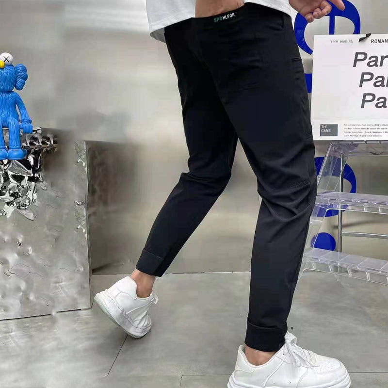 "Herre skinny cargo-bukser, høy stretch, flere lommer, svart farge, moderne design for stilfulle menn."