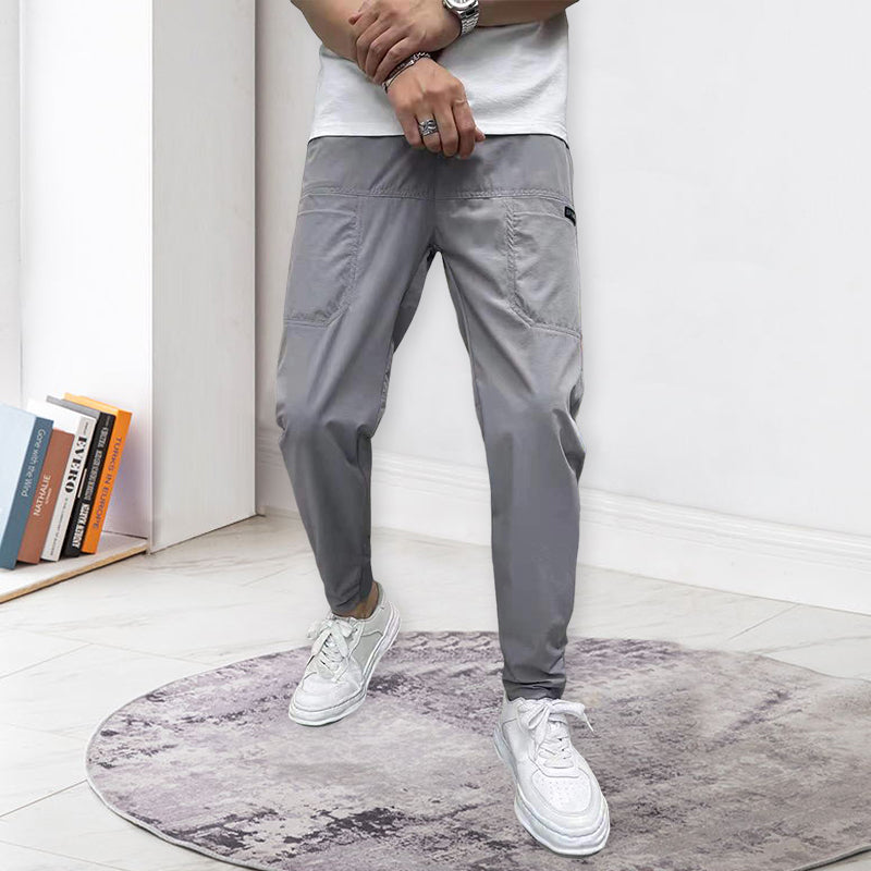 "Herre skinny cargo-bukser, høy stretch, flere lommer, svart farge, moderne design for stilfulle menn."