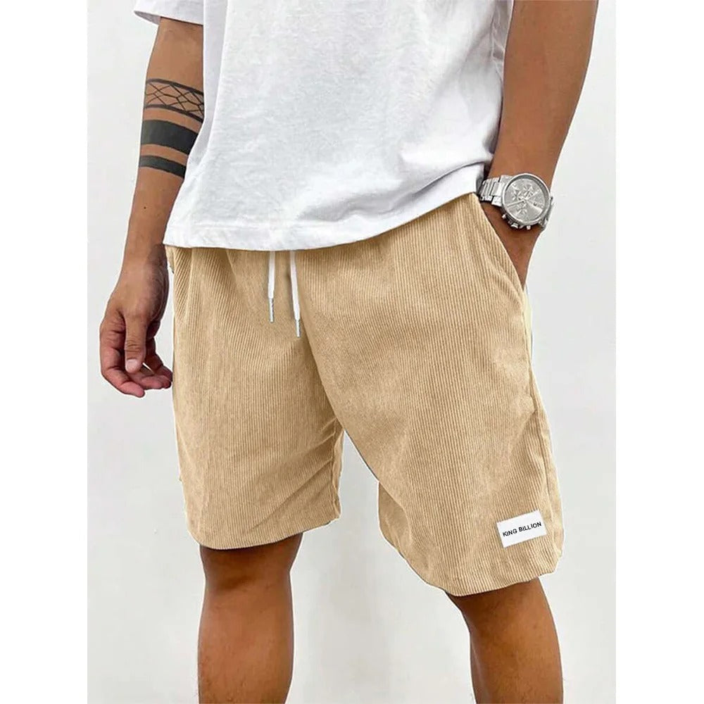 Detaljert bilde av cordfløyelstekstur på menns shorts, casual sommerstil