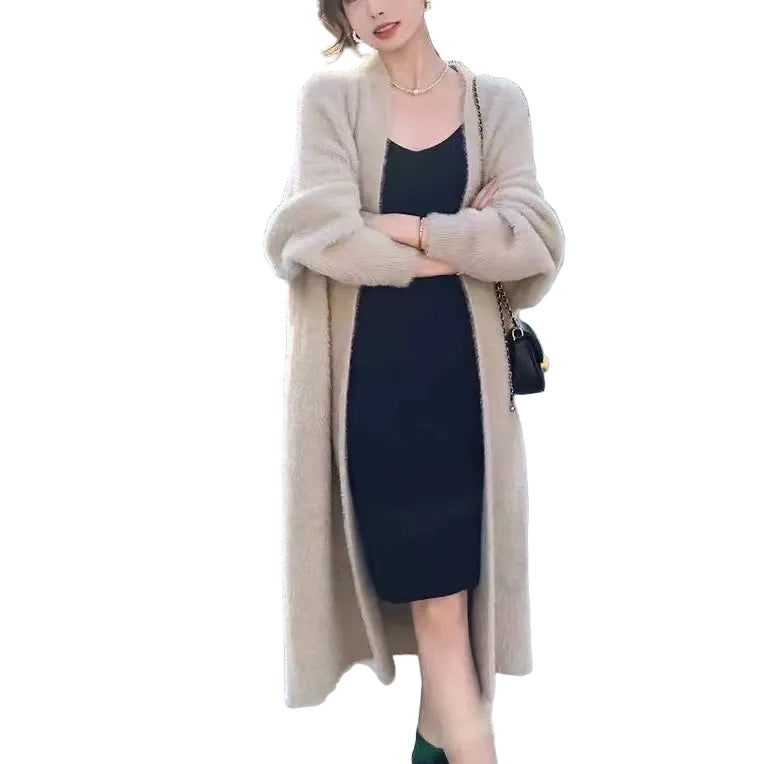 Komfortabel oversized damecardigan med åpen front, ideell for lag-på-lag og hverdag om høsten.