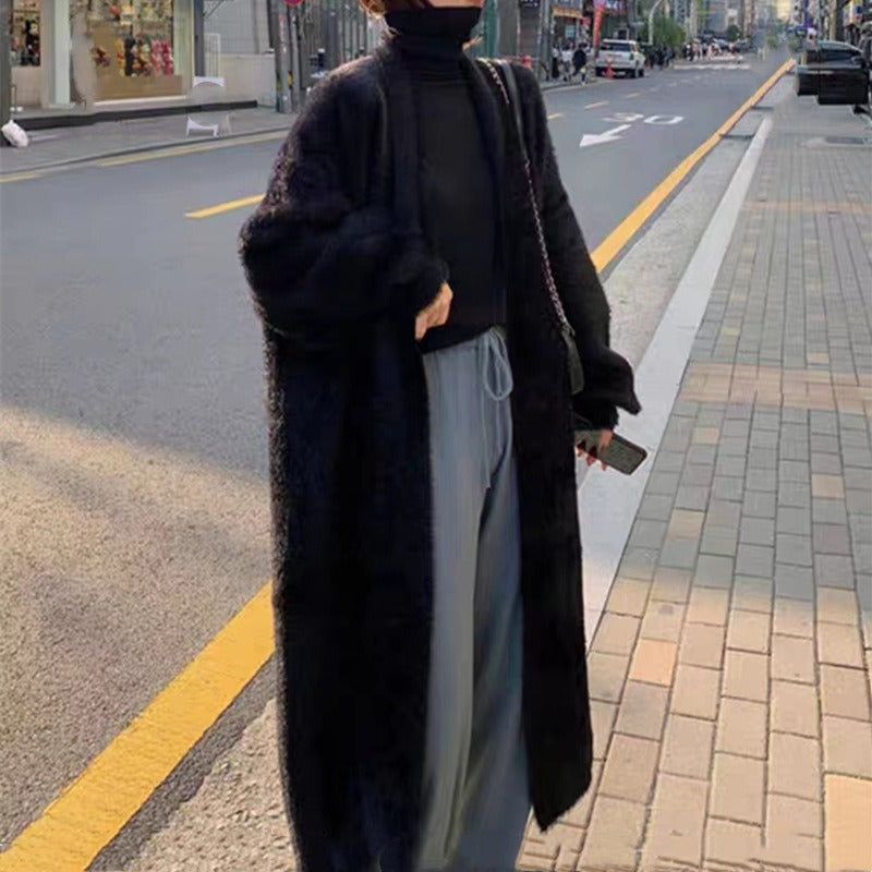 Trendy oversized kvinnecardigan med åpen front. Avslappet passform for en chic lag-på-lag stil i hverdagen.