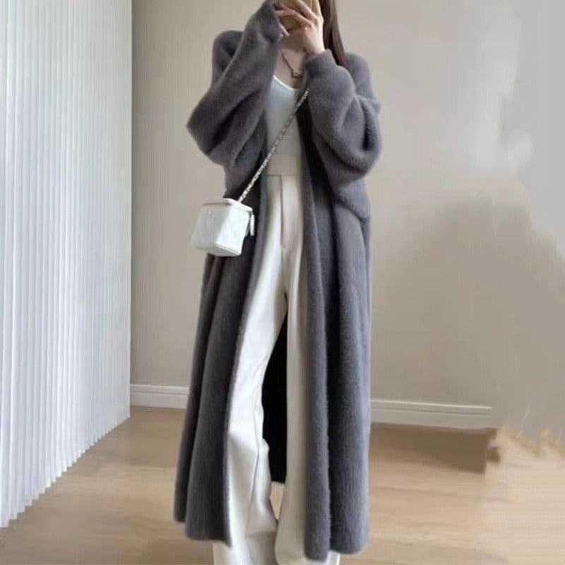 Allsidig damecardigan, oversized og med åpen front. Optimal for en komfortabel og stilfull look over-kneelengde.