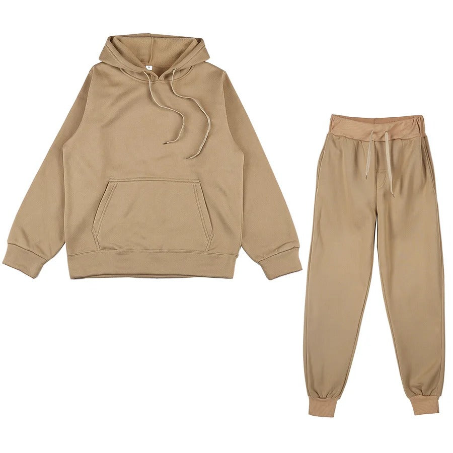 Trendy treningsdress for kvinner, bestående av hettegenser med sidelommer og matchende bukser