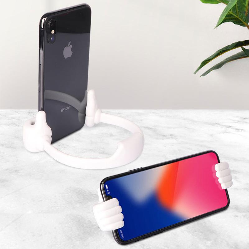 "Kreativ, justerbar mobilholder med tommel opp design. Passer smarttelefoner og nettbrett, tilgjengelig i flere farger."