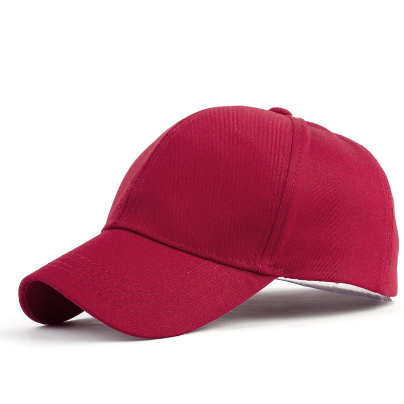 Beige baseballcaps i bomull, designet for kvinner med rotete hårtopper og hestehale.