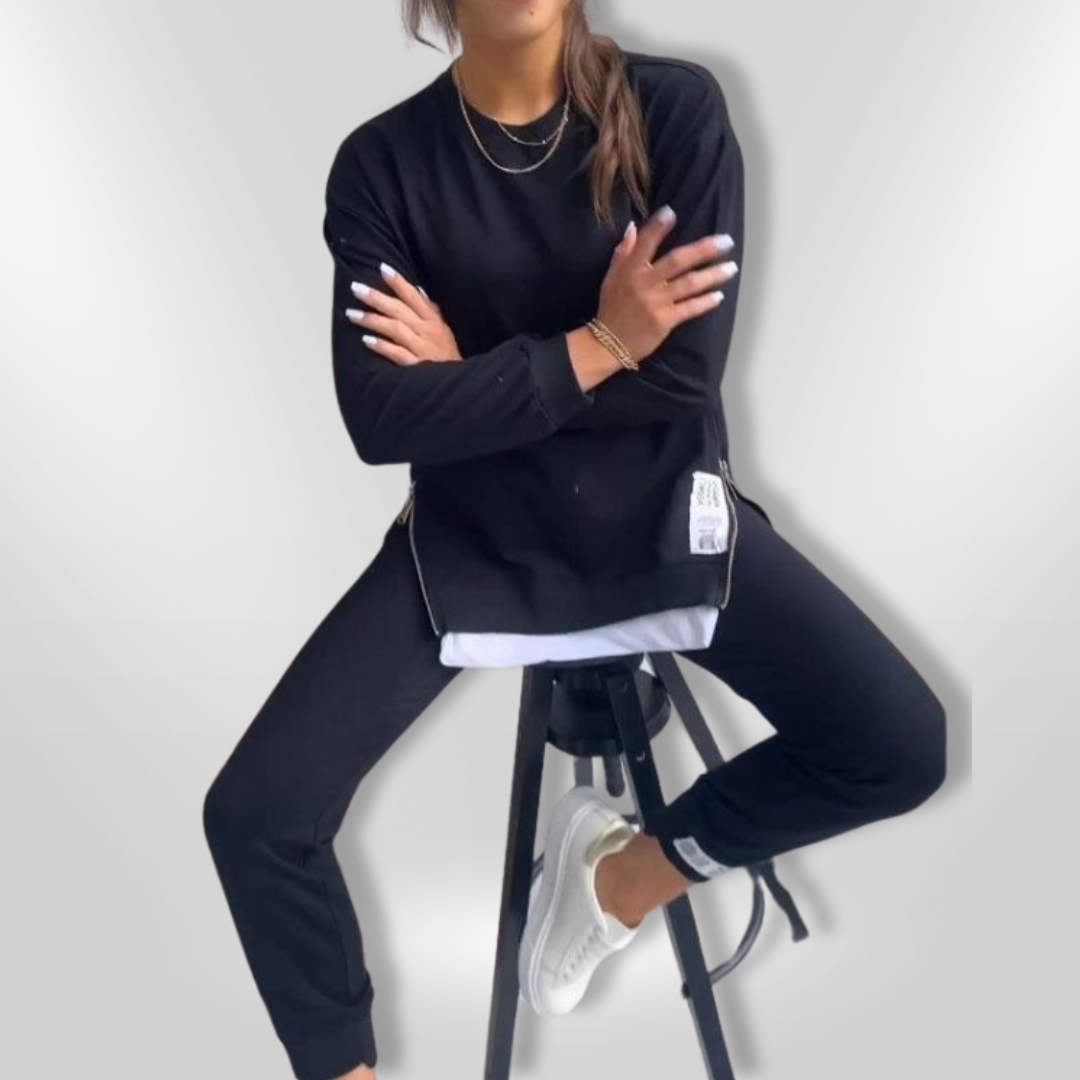 Svart casual loungewear sett for kvinner. Allsidig oversized sweatshirt og avslappede joggers.